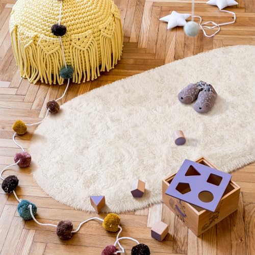 Goideal Fluffy Bedroom Rug, Small Oval Area Rugs, Cream Shag Bedside Carpet for Kids Room Nursery Dorm Cute Fuzzy Indoor Decor for Boy and Girl, 2.6 x 5.3 Feet - color: Cream