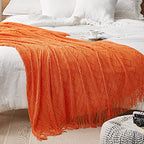 DREAMSUNSET Knit Throw Blanket 50 x 60 Inch, for Couch, Sofa, Bed and Decoration. Super Soft, Comfy and Lightweight. Original Pattern with Tassel Fringes. Sunrise Orange